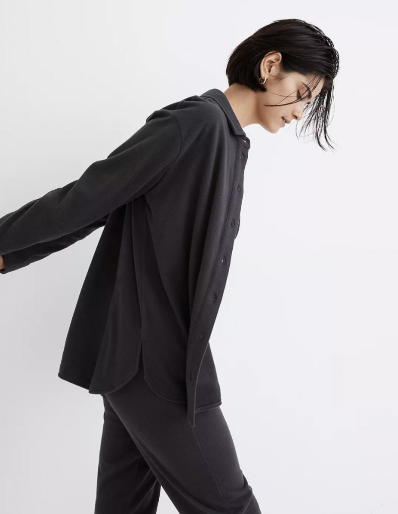 woman posing to the side black in luxury loungewear