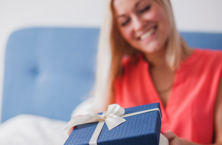 A woman holding a luxury gift