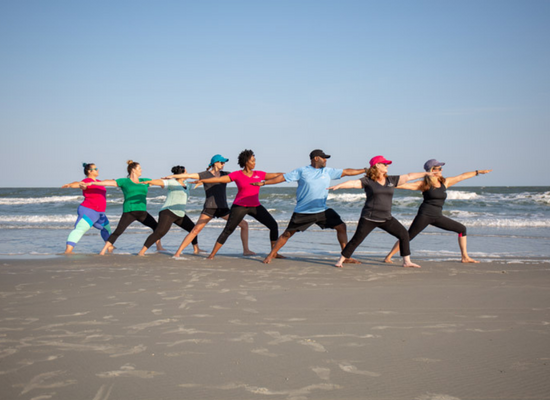 Group of people doing an exercise at the beach